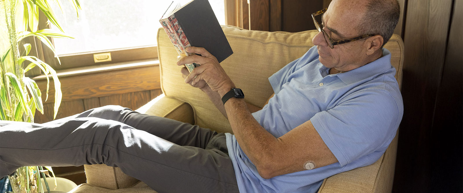 Grandpa checks his glucose readings on his iWatch